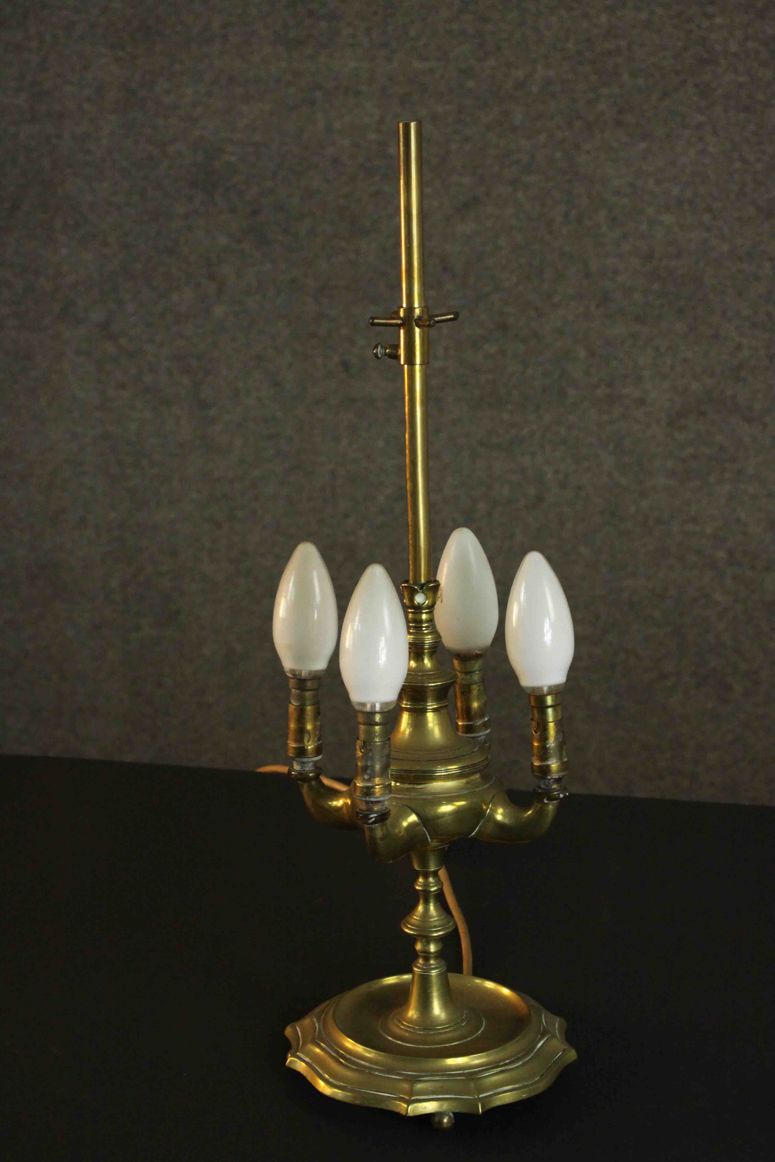 A 19th century brass four branch converted desk lamp on a ridged base. (one foot missing) H.50 Dia.