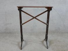 A 19th century mahogany side table, raised on turned 'bamboo' style supports terminating on