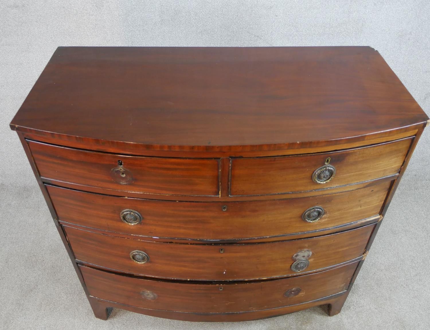 A 19th century mahogany bow fronted chest of two short over three long drawers, raised on shaped - Image 4 of 7