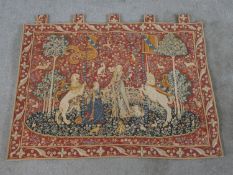 A 20th century French hanging tapestry, depicting figures in a Medieval garden scene. H.82 W.109cm.