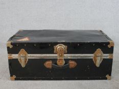 A 20th century black painted metal travelling case/trunk, with studded detail, opening to reveal