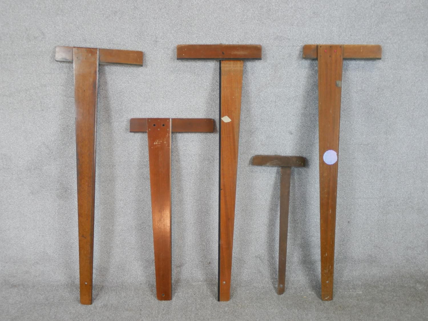 Five assorted 20th century mahogany draughtsman's T-squares. L.113cm (largest)
