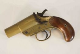 An early 20th century Webley & Scott brass flare gun, with mahogany and brass pistol grip handle,