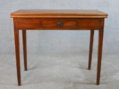A George III mahogany rectangular foldover table with single drawer, raised on square tapering