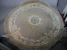 A 20th century beige ground Chinese circular carpet, embroidered with flowers. W.275 D.275cm
