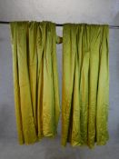 A pair of 20th century green silk like fabric curtains. H.170 W.180