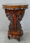 A late 19th/early 20th century Chinese hardwood shaped table with mother of pearl inlay, three