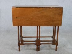 A 19th century mahogany drop leaf gate leg table raised on slender spider leg supports. H.71 W.71