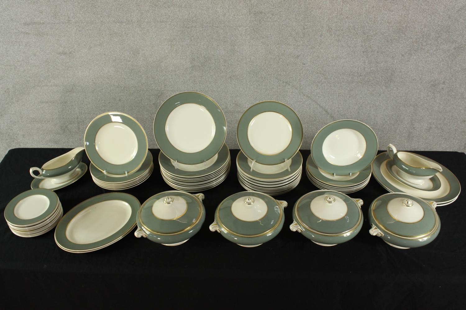 An extensive Crown Ducal porcelain dinner service with grey painted decoration and gold resist