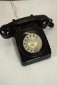 A 20th century black Bakelite GPO desk electric telephone, with wind up number plate. H.12 W.23 D.