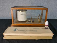 An early 20th century J. Lizars of Glasgow & Edinburgh oak and glass cased barograph with applied