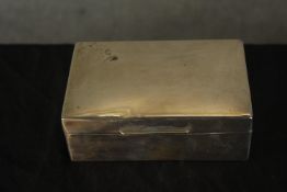 A George V hallmarked silver mounted rectangular cigarette box, London 1925, the hinged lid