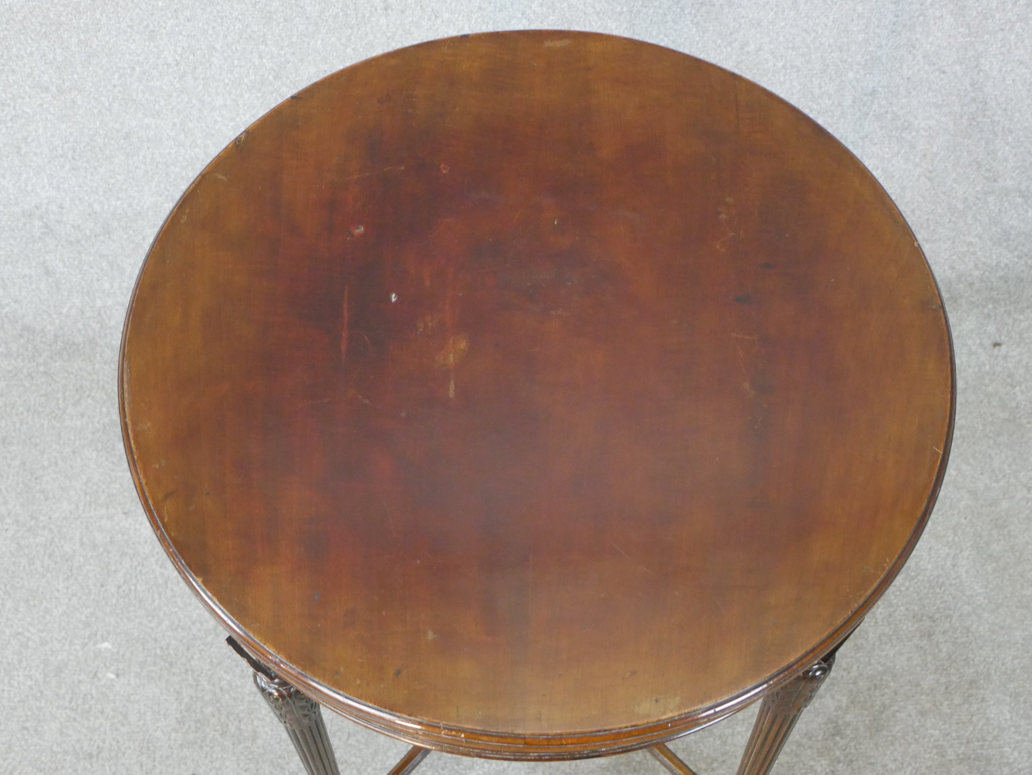 An early 20th century Neo Classical style mahogany circular table, raised on carved and fluted - Image 2 of 7