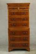 A contemporary George III style yew wood chest on chest, comprising two short over six drawers, with