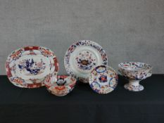 An early 20th century Masons Imari oval meat plate decorated with flowers, together with four