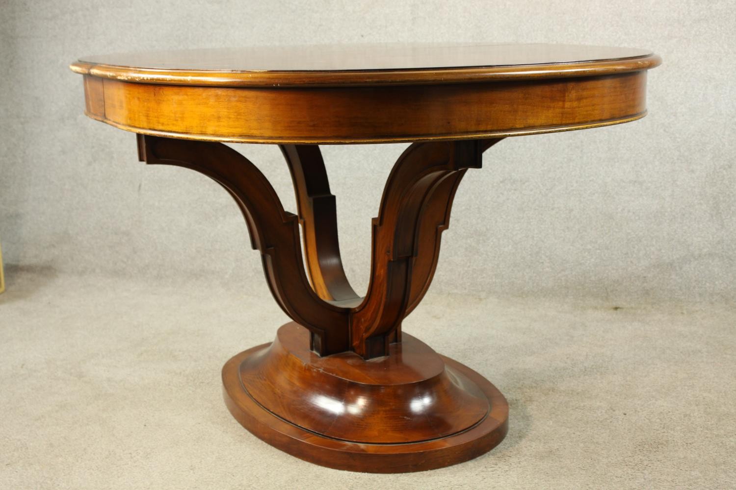 A 20th century mahogany pull oval extendable table, on four carved trumpeting supports terminating - Image 5 of 10