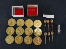 Twelve replica brass British coins, together with with six Elizabeth II Coronation anointing