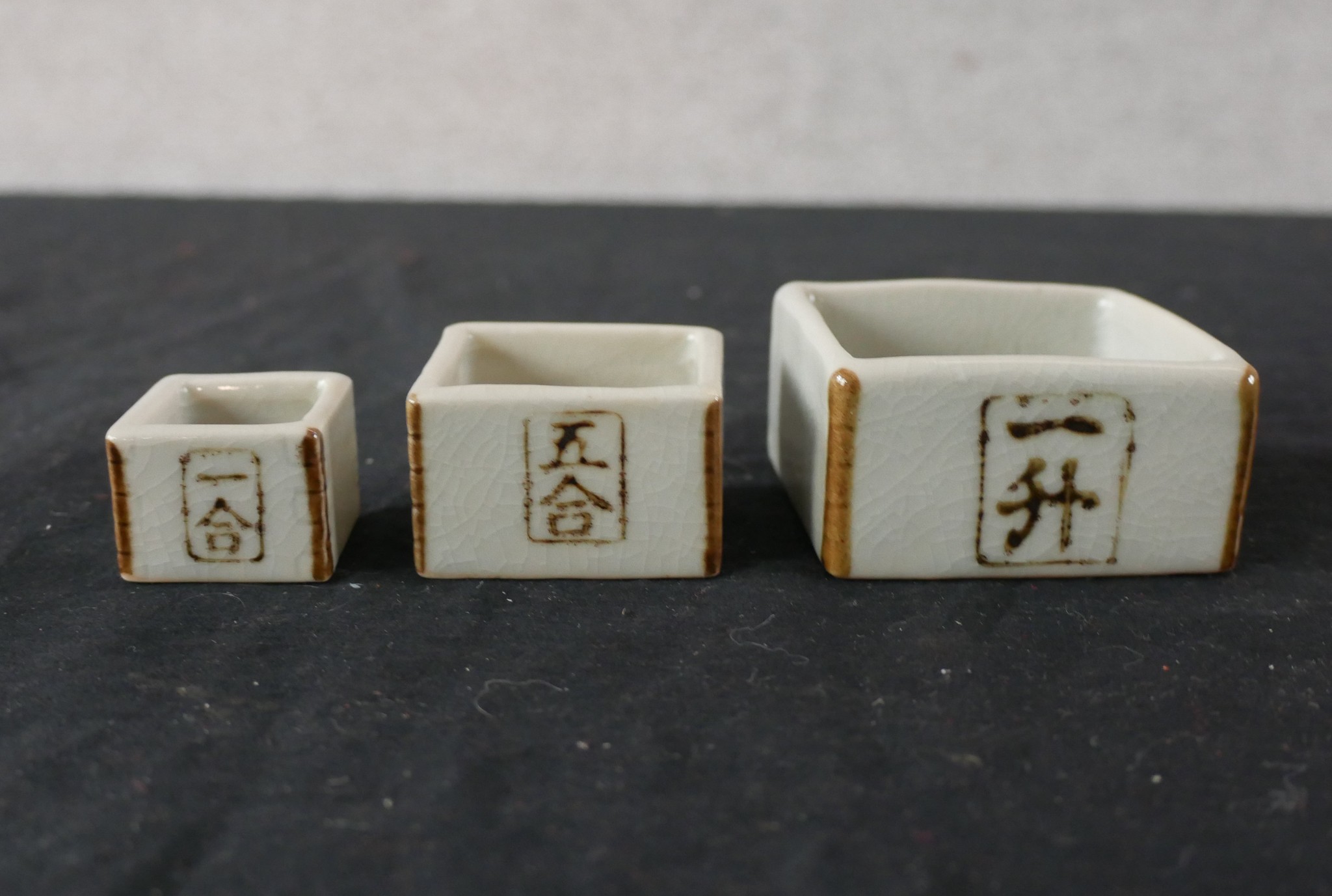 A 20th century Japanese pottery Saki set, together with a small pair of 20th century Chinese - Image 2 of 4