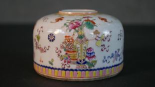 A 19th century hand painted Chinese DouCai porcelain brush washer decorated with flowers,