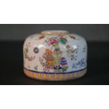A 19th century hand painted Chinese DouCai porcelain brush washer decorated with flowers,