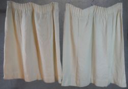 A pair of 20th century cream cotton curtains. H.105 W.67cm