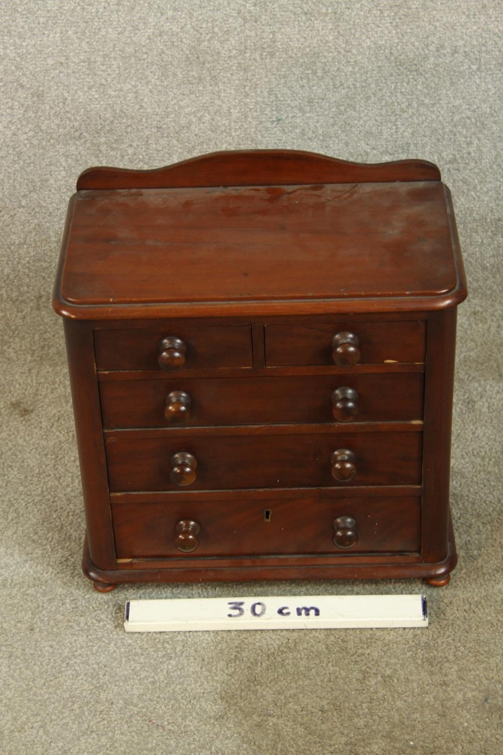 A 19th century mahogany apprentices chest of two short over three graduating drawers with turned - Image 2 of 5