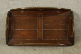 An early 20th century stained mahogany twin handled butlers tray with folding sides. (No stand). L.