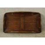 An early 20th century stained mahogany twin handled butlers tray with folding sides. (No stand). L.