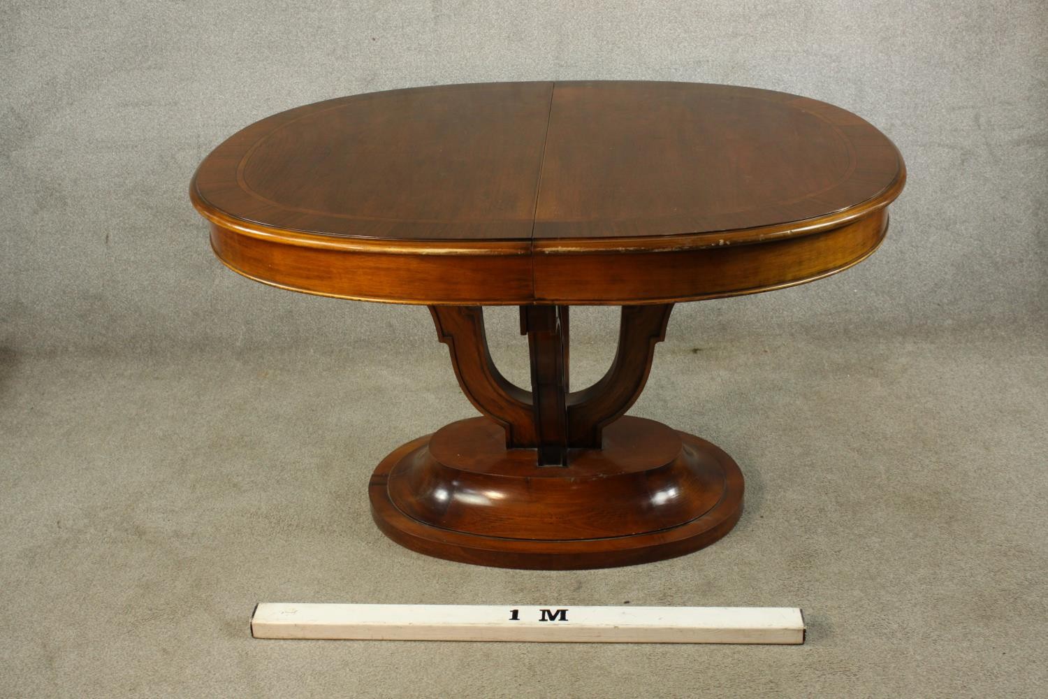 A 20th century mahogany pull oval extendable table, on four carved trumpeting supports terminating - Image 2 of 10