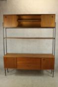 A mid 20th century Avalon teak and metal sideboard unit with three tier shelf with two cupboard