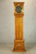 A 20th century Danish Bornholm style pine cased longcase clock, the brass and silvered dial with