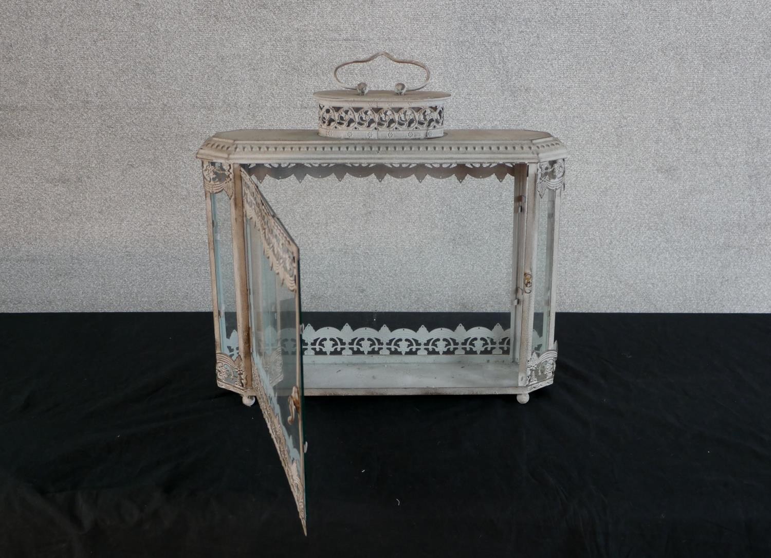 A contemporary painted metal and glass storm lantern, with carrying handle. H.51 W.48 D.13cm - Image 2 of 5