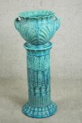 A late Victorian Burmantofts turquoise blue faience jardiniere and stand, moulded with shell