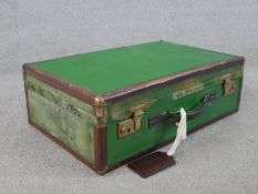 A 20th centurty painted Barbour suitcase with original luggage tag, opening to reveal lined