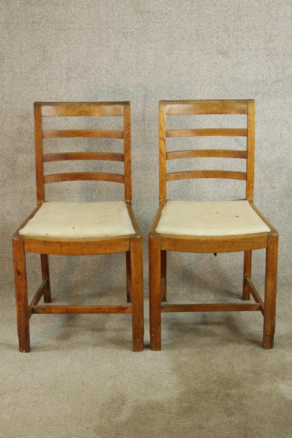 A pair of early 20th century oak framed ladder back chairs, raised on carved supports with drop in - Image 2 of 8