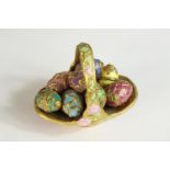 A 20th century painted and richly guilt porcelain Summertime Egg Basket together with nine