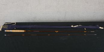 A 20th century Hardy's three piece split cane fishing rod, together with Hardy's carrying case. H.