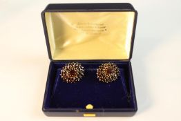 A pair of silver gilt garnet set cluster earrings with secure posts to the back, butterflies stamped