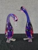 Two 20th century purple and red Murano glass ducks with clear glass feet and beaks. H.37 W.20 D.12cm