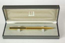 A mid 20th century boxed gold plated Dunhill rollerball pen. H.6 W.17.5 D.4cm. (box)