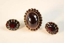 A collection of Bohemian 14ct yellow gold and garnet jewellery. A garnet and a 14 carat yellow