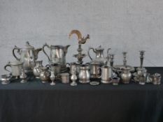 A large quantity of various pewter to include a Scandinavian peg style tankard, jugs, candlesticks