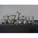 A large quantity of various pewter to include a Scandinavian peg style tankard, jugs, candlesticks