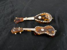 A 19th century tortoiseshell and bone miniature guitar and matching lute. H.3 W.14 D.4.5cm largest