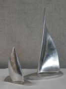 Two 20th century Canadian polished pewter sailing boat ornaments, each with applied label to base.