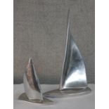 Two 20th century Canadian polished pewter sailing boat ornaments, each with applied label to base.