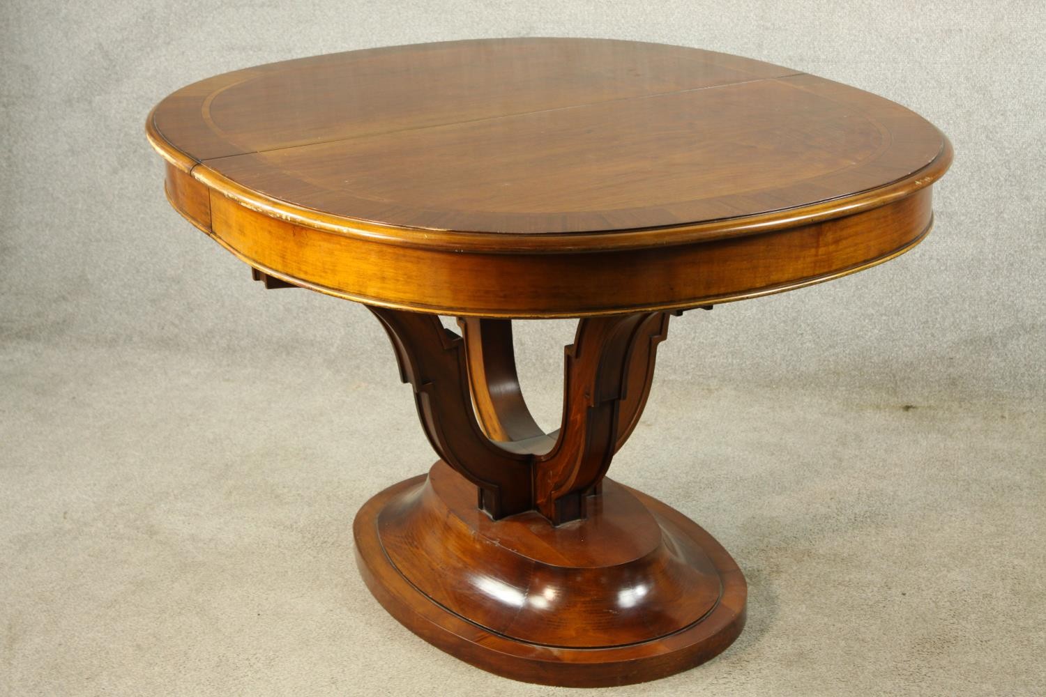 A 20th century mahogany pull oval extendable table, on four carved trumpeting supports terminating - Image 9 of 10
