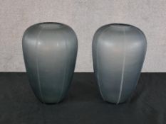 A pair of mid 20th century Donna Karan grey etched glass baluster shaped vases, each with etched