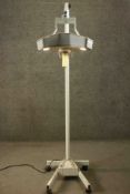 Luxo, a late 20th century dentist's light, with a tri-form top set with three bulbs, on an