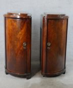 A pair of late 19th/early 20th century mahogany Biedermeier single door book shelves, raised on